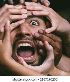 Not All Monsters Are Under The Bed, Some Are In Your Head. Shot Of Hands Grabbing A Young Mans Face Against A Dark Background.