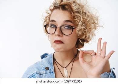 Not Bad, You Did Great. Portrait Of Impressed And Surprised Good-looking Blond Funny Woman In Glasses Pursing Chin And Looking Like Expert At Camera, Showing Okay Gesture Giving Judgemental Acception