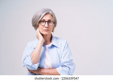 Not Happy, Upset Mature Businesswoman In Blue Shirt With Skeptical Facial Expression On Her Face Looking At Camera Isolated On White Background. Senior Woman Beauty And Health Care.