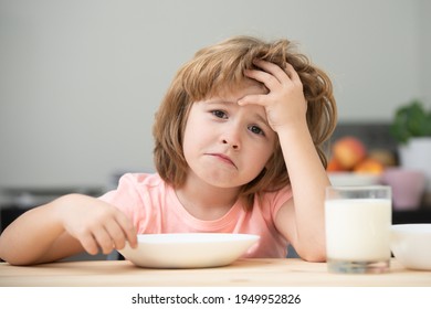 Not Hungry. Kid Refusing To Eat. Child Have No Appetite. Upset Little Kid Refuse To Eat Organic Cereals With Milk. Child Nutrition