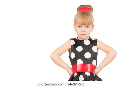 Not Impressed With You. Studio Shot Of A Little Girl In A Dress Looking Grumpy