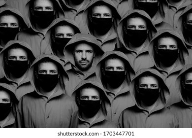 Not Like Everyone, A Man Is Not Wearing A Protective Mask Among Other People Wearing Masks. Concept Of Social Consciousness And Proper Behavior During A Coronavirus Pandemic