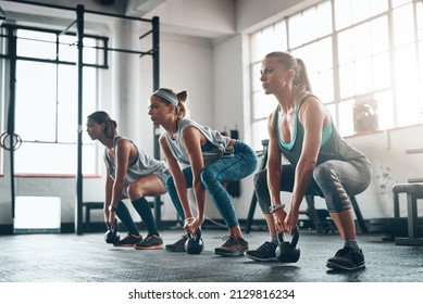 Its not meant to be easy. Shot of three young women working out together. - Powered by Shutterstock