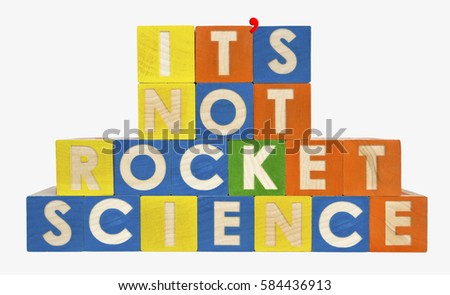 IT'S NOT ROCKET SCIENCE concept spelled with toy blocks. With apostrophe. Isolated.