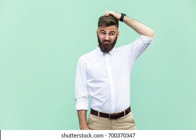 Not sure. Young adult businessman have a doubt. Studio shot - Shutterstock ID 700370347