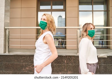 Not Touch People In Mask Portrait. New Normal. Corona Virus Safety. Two Women Stand At Town. Friends. Playground Background. Outdoors. Health Care