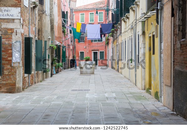 A not\
touristy spot in Venice. The beauty of this city is also in the\
hidden and unknown residential areas where the architecture is old,\
popular and simple as the materials it is made\
of