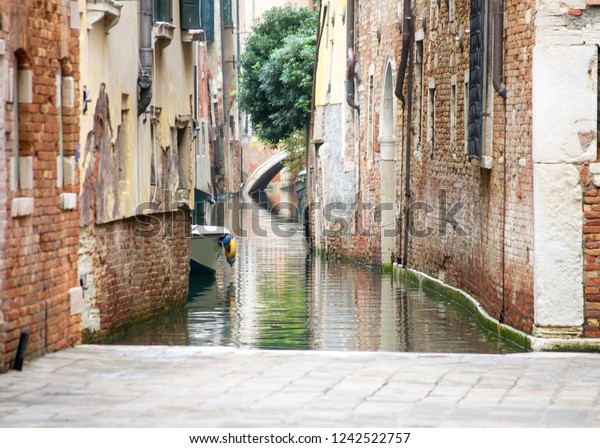 A not\
touristy spot in Venice. The beauty of this city is also in the\
hidden and unknown residential areas where the architecture is old,\
popular and simple as the materials it is made\
of
