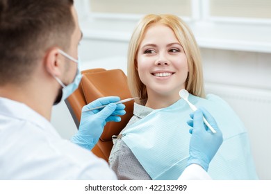 Not Worried At All. Portrait Of A Cheerful Smiling Female Client At The Dentist Appointment Receiving Care Advice From Her Doctor