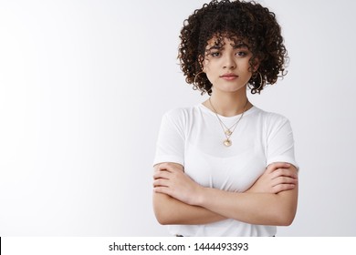 Not your toy. Serious-looking determined assertive good-looking stylish curly hairstyle female cross arms chest confident look camera ready, aim success, believe girl power, white background