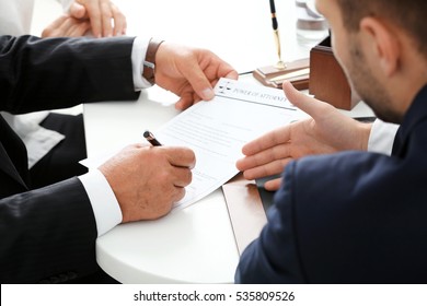 Notary with client in office