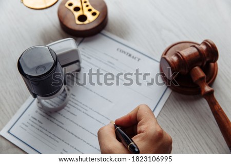 Notary man signing the document close-up. Notary public tools
