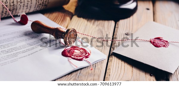Notary public
wax stamper and wax seal on
document