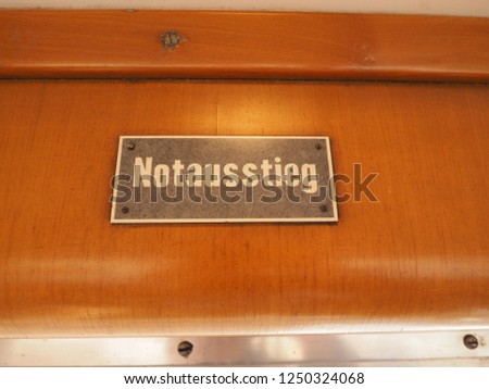 Notausstieg (meaning Emergency exit) sign on vintage German tram