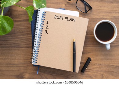 Note Book With 2021 Goals Text On It To Apply New Year Resolutions And Plan.