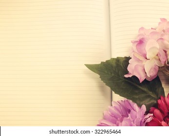 Note Book Diary And Beautiful Flower Bouquet With Vintage Filter Instragram Effect;