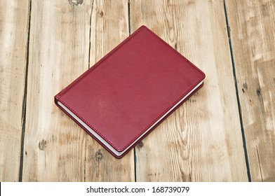Note book on wood background 