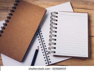 Note Book On Wooden Background