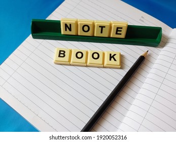 Note Book ,pencel ,alphabet On Blue Background