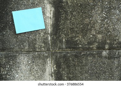 note with cement wall