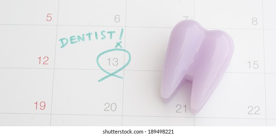 A Note Of A Dentist Appointment On A Calendar 