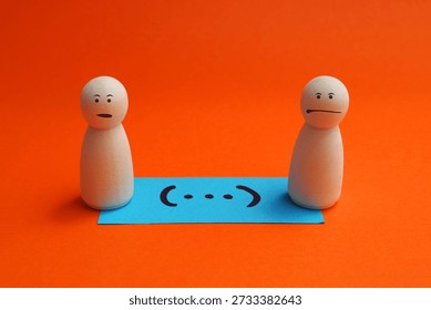 Note with ellipses in parentheses next to two people with worried faces