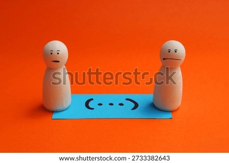 Note with ellipses in parentheses next to two people with worried faces