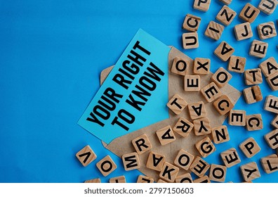 Note in envelope written YOUR RIGHT TO KNOW. Education concept. Knowledge. Disseminating important knowledge. Public information. Blue background and block letter spread