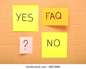 note with faq mark over brown cardboard
