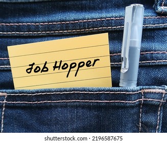 Note in jean pocket with handwritten text JOB HOPPER, means person who works briefly in one position after another rather than staying long  term in organization