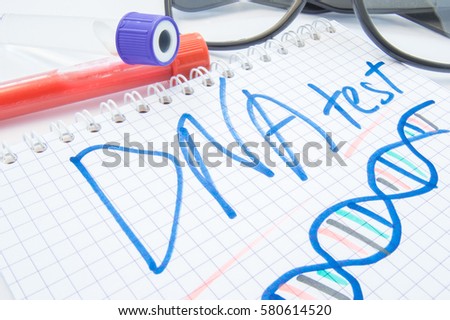 Note labeled DNA test and DNA formula lies next to test tubes with blood, biomaterial and glasses. DNA test or analysis procedure concept to determine ancestry, paternity, familytree, genetic diseases