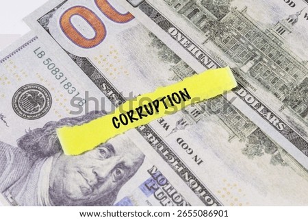 A note marked “Corruption” is set on a spread of cash, highlighting misuse of public funds and unethical financial practices.


