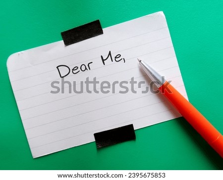 Note on green background with handwritten text DEAR ME, concept of self compassion by writing compassionate note to self, beat negative inner voice