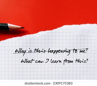 Note on orange background with handwriting WHY THIS HAPPENING TO ME? changed to WHAT CAN I LEARN FROM THIS? to overcome negative self talk,replace with positive thought, lesson learned  from hardship - Shutterstock ID 2309175383