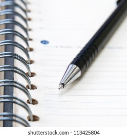 Note pad with pen close up,selective focus