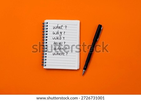 Note pad with word what? why? who? how? when? where?