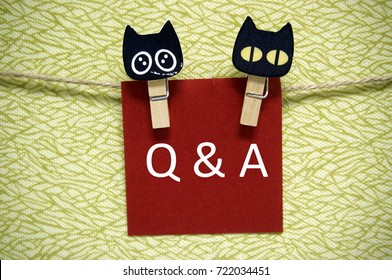 Note paper with cat head shaped paper clip written 