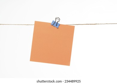 Note Of Paper Hanging On A Cord With A Clamp