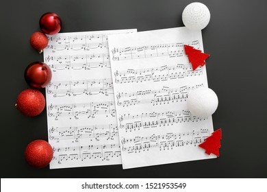 Note sheets and Christmas decor on table