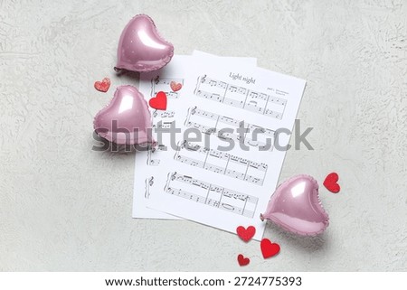 Note sheets with hearts and balloons on white grunge background. Valentine's Day celebration