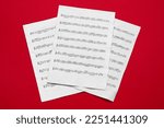 Note sheets on red background, flat lay