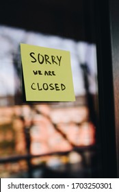 Note Or Sign On Front Door Of A Shop, Restaurant Or Other Small Business Saying 