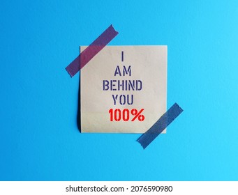 Note Stck On Blue Background Written - I Am Behind You 100% - Means Totally Support Someone, Telling Them You Completely Behind Them, Encouragement Note