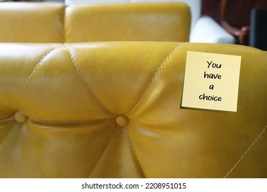 Note Stick On Yellow Sofa With Handwriting YOU HAVE A CHOICE, To Remend Self Not To Feel Trapped, Everyone Have More Choices Available Than Realize In Any Given Moment