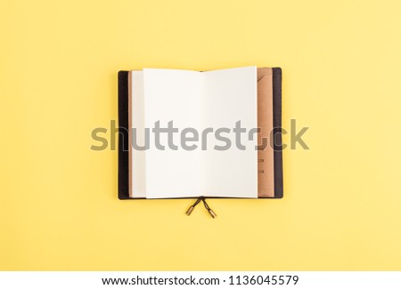 notebad on yellow background