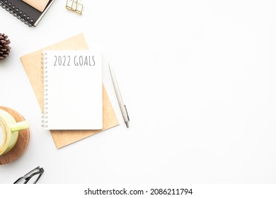 Notebook With 2022 Goals Text On It To Apply New Year Resolutions And Plan.