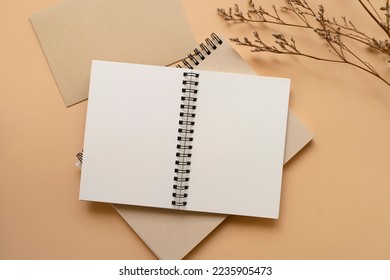 Notebook, A5, A6, metal ring bind, with white cream paper, with dried flowers and envelope. Stationary mockup template. 