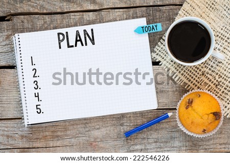 Notebook with an action plan and sticker today on wooden desk with cup of coffee and muffin