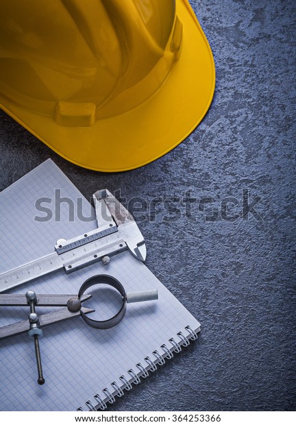 Notebook building helmet drawing compass vernier\
scale construction\
concept.