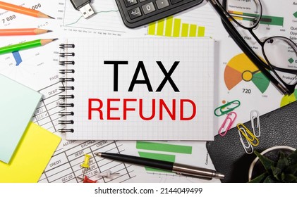 Notebook with a Business notes TAX REFUND on the office table with tools. Concept TAX REFUND with elements of infographics - Shutterstock ID 2144049499